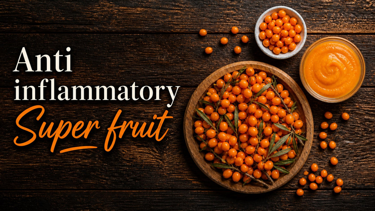 Top-down view of sea buckthorn berries in a wooden bowl and a glass dish of smooth orange puree on a rustic dark wood background with "Anti inflammatory Super fruit" text.