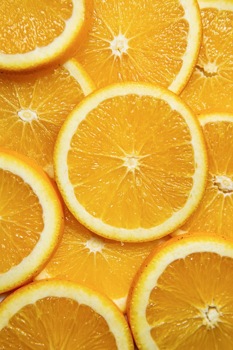 A pile of oranges — the default vitamin C source, but not the best