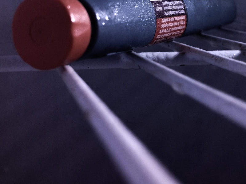 GLP-1 injection pen resting in a refrigerator door, representing GLP-1 agonist therapy